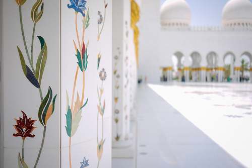 abu dhabi white floral pillar of white concrete building jar
